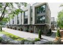 A row of modern townhomes with gray siding, large windows and landscaping at 1160 Ormewood Ave # 13, Atlanta, GA 30316