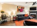 Comfortable living room showcasing a fireplace, TV, and well-appointed furniture under ceiling fan at 1501 Eastern Sunrise Ln, Decatur, GA 30034