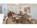 Elegant dining room featuring modern chandelier and stylish decor at 794 Casplan St, Atlanta, GA 30310