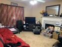 Cozy living room featuring a fireplace, TV, and unique decorative elements at 109 Millwheel Dr, Villa Rica, GA 30180