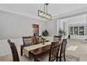 Formal dining room with wood table set and view of living area built-ins at 1165 Lea Dr, Roswell, GA 30076