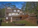 A spacious deck and stone patio enhance this home's backyard, perfect for entertaining or relaxation, and enjoying outdoor living at 4292 Rocky Ne Gln, Roswell, GA 30075