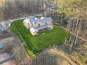 Aerial view of a new home under construction with a large, manicured lawn at 225 Maison Court, Roswell, GA 30076