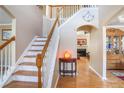 Bright foyer with hardwood floors, staircase, and decorative details at 2835 Olde Town Park Dr, Norcross, GA 30071