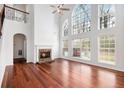 Spacious living room with hardwood floors, fireplace, high ceilings and lots of natural light at 5658 Greensage Dr, Atlanta, GA 30349