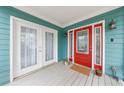 Inviting front porch with colorful door, bright lighting, and ample space for decor at 1027 Kirkwood Se Ave, Atlanta, GA 30316