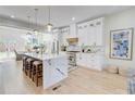 Bright, modern kitchen with a marble-topped island, stainless steel appliances, and white cabinetry at 1456 S Gordon Sw St, Atlanta, GA 30310