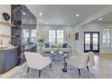 Airy living room featuring a chic seating arrangement, modern decor, and a stylish accent wall at 1456 S Gordon Sw St, Atlanta, GA 30310