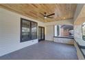 Inviting covered porch with a wood ceiling, tile floor, and black-framed windows offering a relaxing outdoor space at 1456 S Gordon Sw St, Atlanta, GA 30310