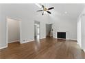 Inviting living room boasting vaulted ceilings, fireplace, and hardwood floors at 135 S Falcon Blf, Alpharetta, GA 30022