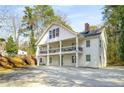 Charming two-story home with covered porch, and an external staircase, perfect for enjoying the outdoors at 1596 Willowbrook Sw Dr, Atlanta, GA 30311