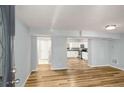 Bright living space features beautiful hardwood floors and easy access to the adjacent kitchen area at 1596 Willowbrook Sw Dr, Atlanta, GA 30311