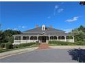 A beautiful clubhouse features a large front porch and attractive landscaping in a well-maintained community at 625 Aunt Lucy Ln # 45, Smyrna, GA 30082