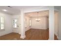 Elegant dining room featuring hardwood floors, crown molding, and a stylish chandelier at 625 Aunt Lucy Ln # 45, Smyrna, GA 30082