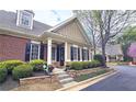 Inviting home featuring manicured landscaping, a cozy porch, and classic architectural details at 625 Aunt Lucy Ln # 45, Smyrna, GA 30082