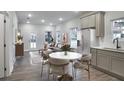 An open floorplan connects a cozy living room to a dining area and a modern kitchen at 1005 Sims Nw Ave, Atlanta, GA 30318