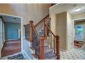 Inviting foyer features hardwood floors, a staircase with decorative wrought iron, and lots of natural light at 1315 Bustling Sw Ln, Marietta, GA 30064