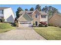 Charming two-story home with a stone accent and well-manicured lawn at 3707 Mcguire Nw St, Kennesaw, GA 30144