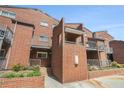 Charming brick townhouse with private balconies and well-maintained landscaping at 377 Ralph Mcgill Ne Blvd # H, Atlanta, GA 30312