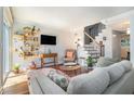 Stylish living room with hardwood floors, ample seating, and modern shelving at 377 Ralph Mcgill Ne Blvd # H, Atlanta, GA 30312