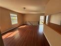 Bright and airy living room featuring hardwood floors, large windows, and an open layout perfect for entertaining at 1315 Old Coach Sw Rd, Marietta, GA 30008
