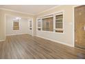Inviting living room showcases wood-look floors and natural light from boarded windows at 1907 Oak Valley Rd, Decatur, GA 30035