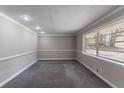 Bright living room featuring neutral walls, plush carpeting, large window, and recessed lighting at 1956 Joseph Ct, Decatur, GA 30032