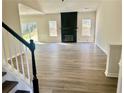 Spacious living room boasting new floors, fireplace, natural light, and neutral wall colors at 4192 Medlock River Ct, Snellville, GA 30039