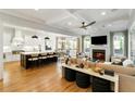 Open-concept living space with a modern kitchen, fireplace, and coffered ceilings at 1720 Barclay Close Nw, Atlanta, GA 30318