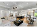 Bright living area seamlessly connects to the kitchen and dining area with modern furnishings at 1720 Barclay Close Nw, Atlanta, GA 30318