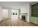 Spacious living room with fireplace, built-ins and ample natural light streaming in at 1923 Brian Way # 1923, Decatur, GA 30033