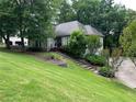 Landscaped front yard with lush green grass leading up to the front of the two-story home at 3897 Beacon St, Marietta, GA 30062