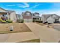 Charming two-story home with a long driveway and well-manicured lawn at 359 Woodridge Pass, Canton, GA 30114