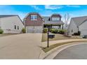 Charming two-story home with a well-manicured lawn and a long driveway at 359 Woodridge Pass, Canton, GA 30114
