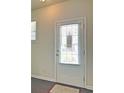 Interior view of a white paneled entry door with window panes and interior blinds at 234 Madison Ave, Acworth, GA 30102