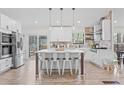 Modern kitchen with stainless steel appliances, an island with seating, and plenty of cabinet space at 3378 Peachtree Chase, Duluth, GA 30096