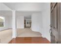 Inviting foyer with hardwood floors, elegant columns, and a view into the spacious living areas at 5480 Beaver Ridge Drive Dr, Cumming, GA 30040