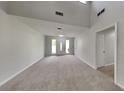 Sun-filled living room features large windows and a freshly painted neutral color palette at 4111 Sweet Water Ct, Conyers, GA 30094