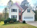 Charming two-story home with attached garage and well-manicured front lawn at 1535 Wilkes Crest Dr, Dacula, GA 30019