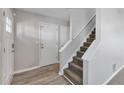 Inviting foyer with neutral paint, durable flooring, and staircase access to the upper level at 5570 Downs Way, Lithonia, GA 30058