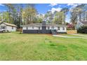 Charming one-story home with manicured front yard, walkway, brick chimney, and lovely front yard at 1990 Venetian Sw Dr, Atlanta, GA 30311