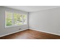 Light-filled room with hardwood floors and large windows, creating a bright and airy space at 131 Brownlee Rd, Atlanta, GA 30331