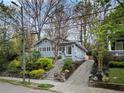 Beautiful home with stone retaining walls, manicured landscaping, and a private driveway at 973 Todd Ne Rd, Atlanta, GA 30306