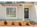 Close-up of front entrance with new mulch and a tidy exterior at 10331 Wrens Dr, Jonesboro, GA 30238