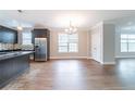 Modern kitchen with stainless steel appliances, granite countertops, and ample cabinet space, perfect for cooking at 4915 Wycliffe Dr, Stone Mountain, GA 30087