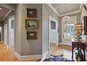 Inviting foyer with hardwood floors, elegant lighting, and decorative artwork at 55 Hazelbrook Way, Acworth, GA 30101