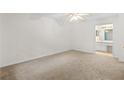 Spacious bedroom with a ceiling fan and an attached bathroom with a vanity area at 1606 Vicksburg Pl, Atlanta, GA 30350