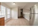 Bright, open kitchen featuring plenty of natural light and tiled floors at 5175 Walker Rd, Stone Mountain, GA 30088