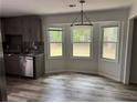 Updated kitchen nook with stainless steel appliances, granite countertops, and lots of natural light at 6921 Babbling Brook Dr, Rex, GA 30273