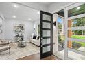Bright living room featuring modern decor, stylish furnishings, and hardwood floors at 1604 Niskey Lake Sw Rd, Atlanta, GA 30331